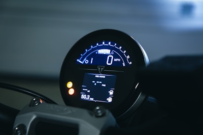 a close up of a speedometer on a motorcycle
