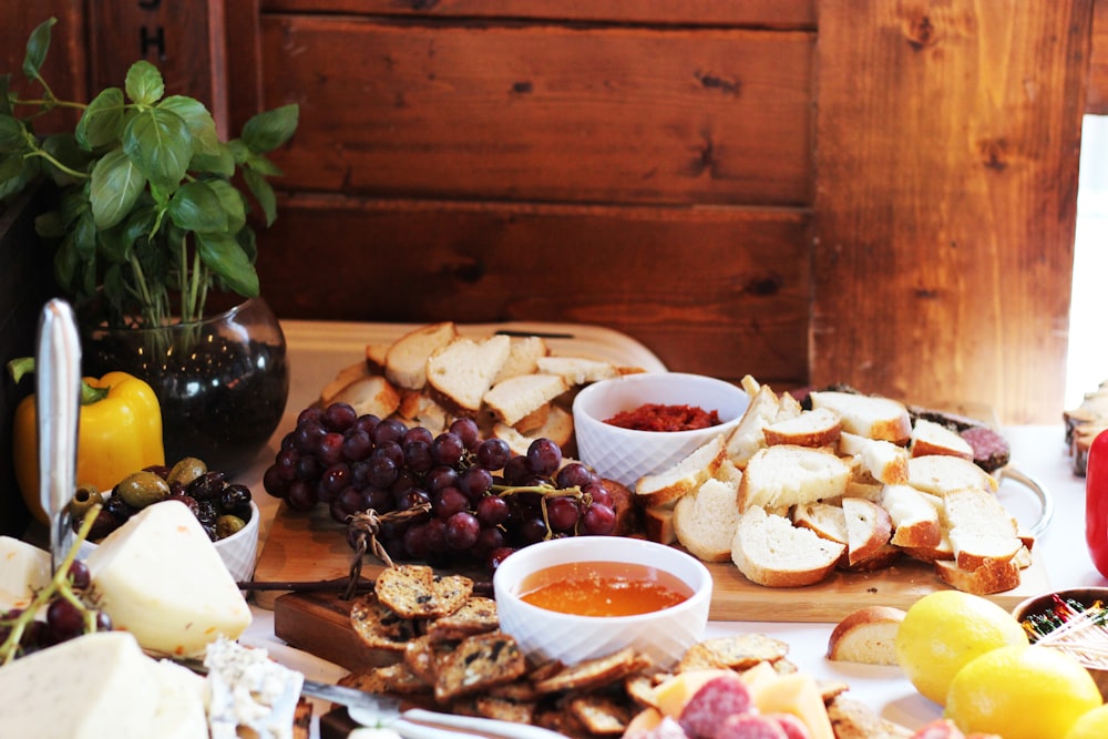 a wooden table topped with lots of food