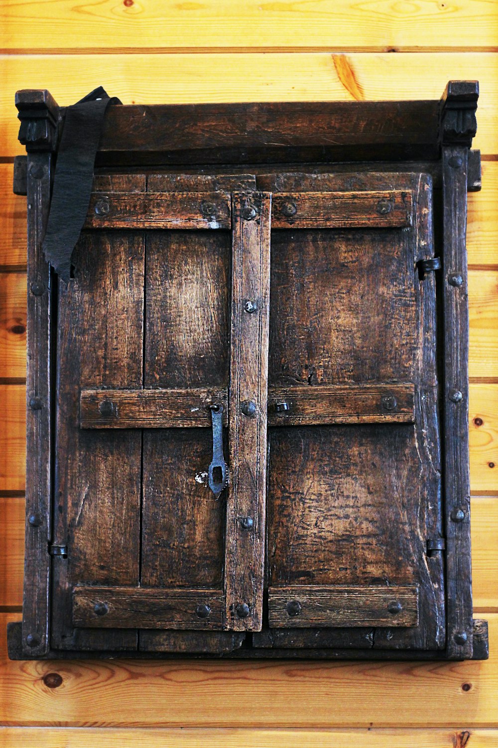 a close up of a wooden door on a wall