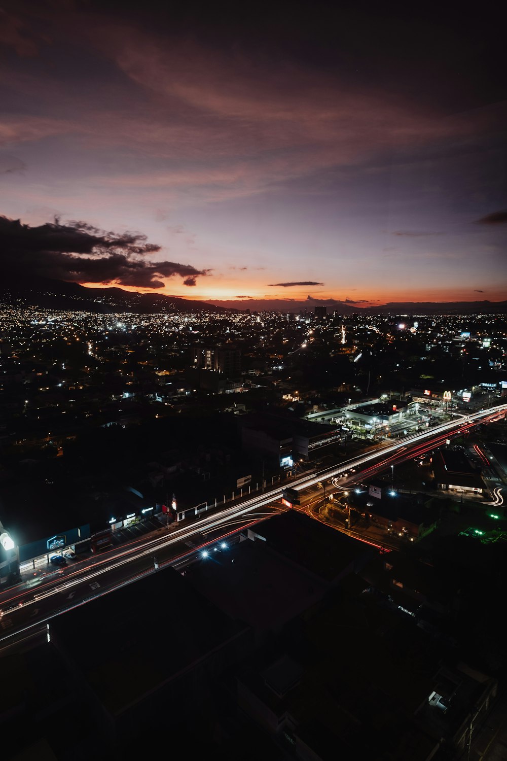 an aerial view of a city at night