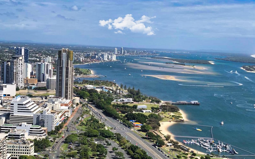 an aerial view of a city and a body of water