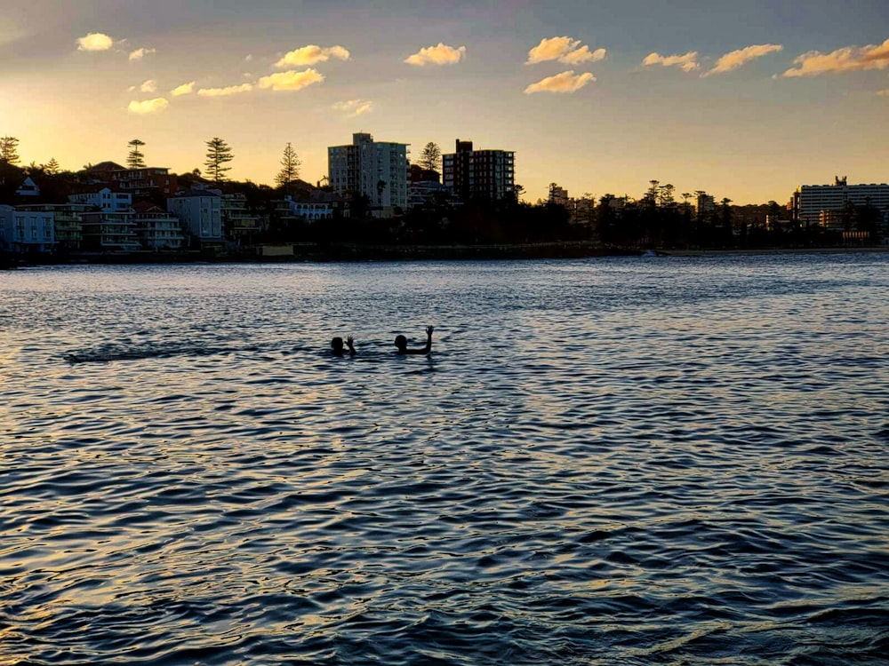 a group of people riding on the back of a boat