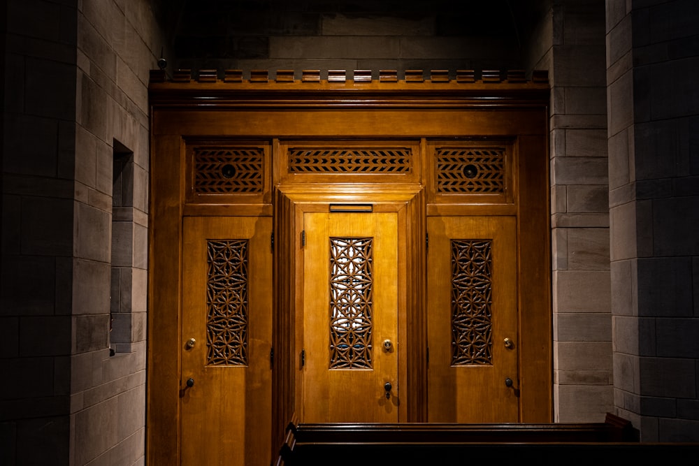 a wooden door with a bench in front of it