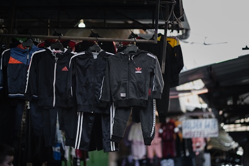 a bunch of clothes hanging on a rack