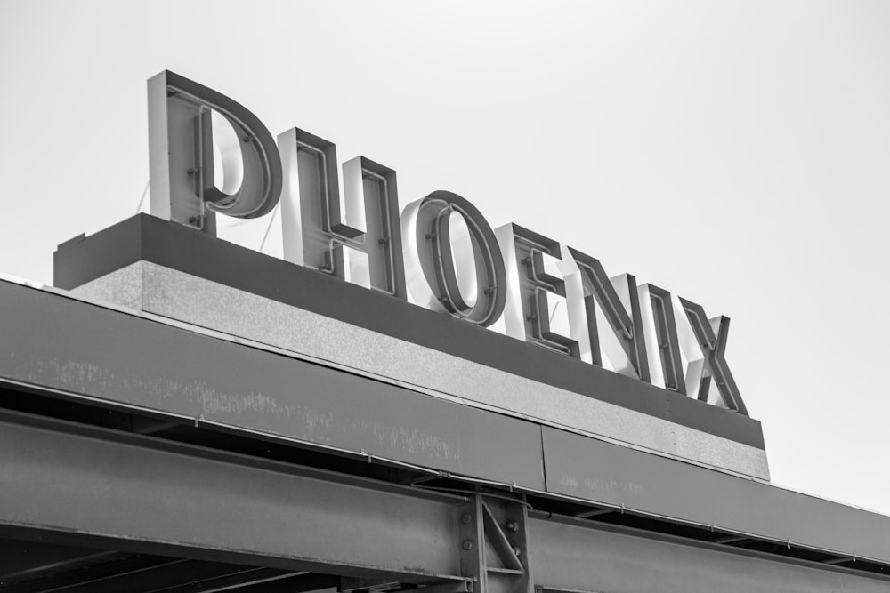 a black and white photo of a sign for a store