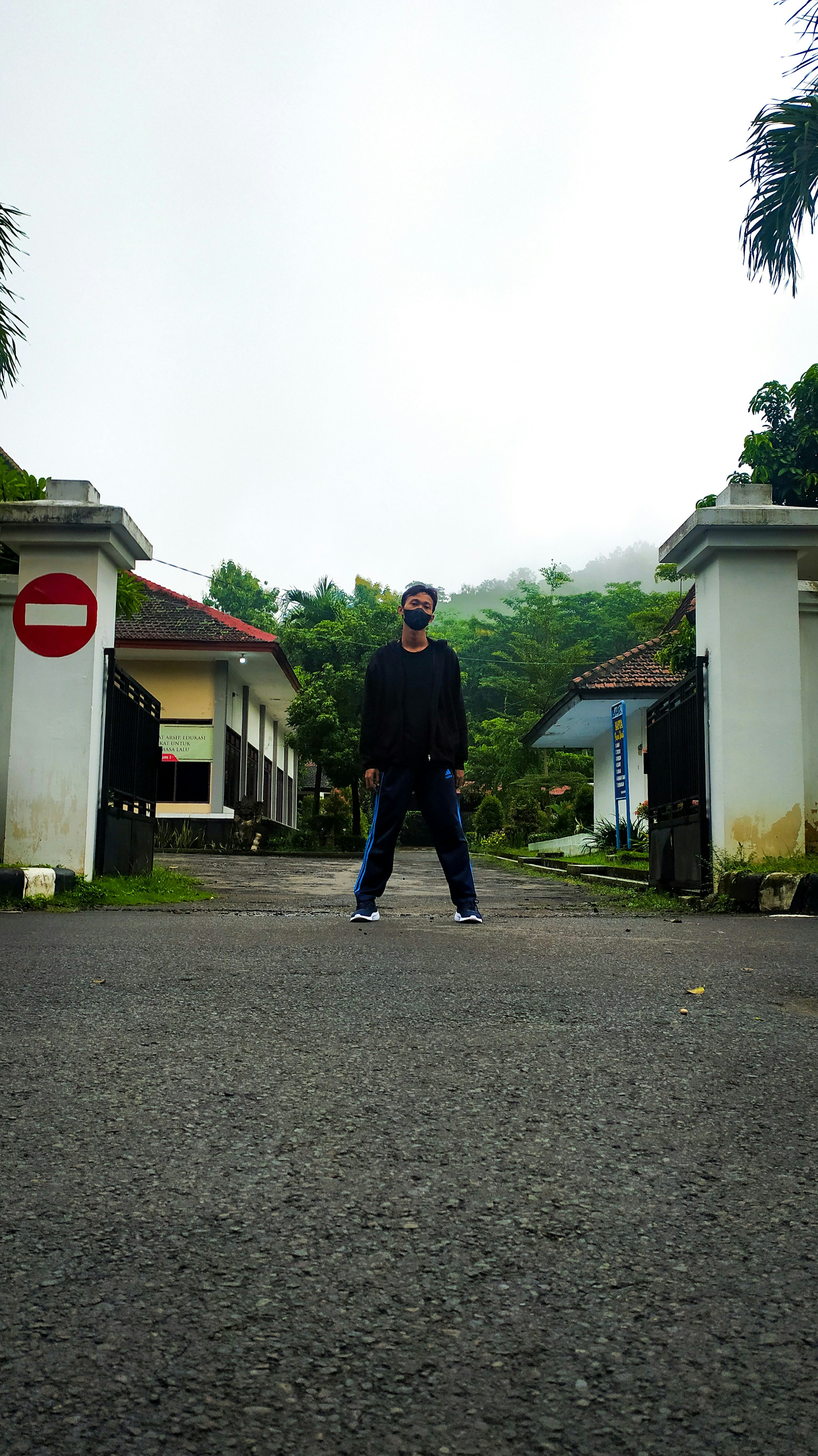 a man standing in the middle of a street