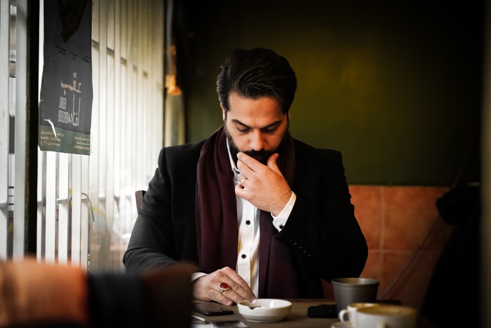 a man sitting at a table eating food