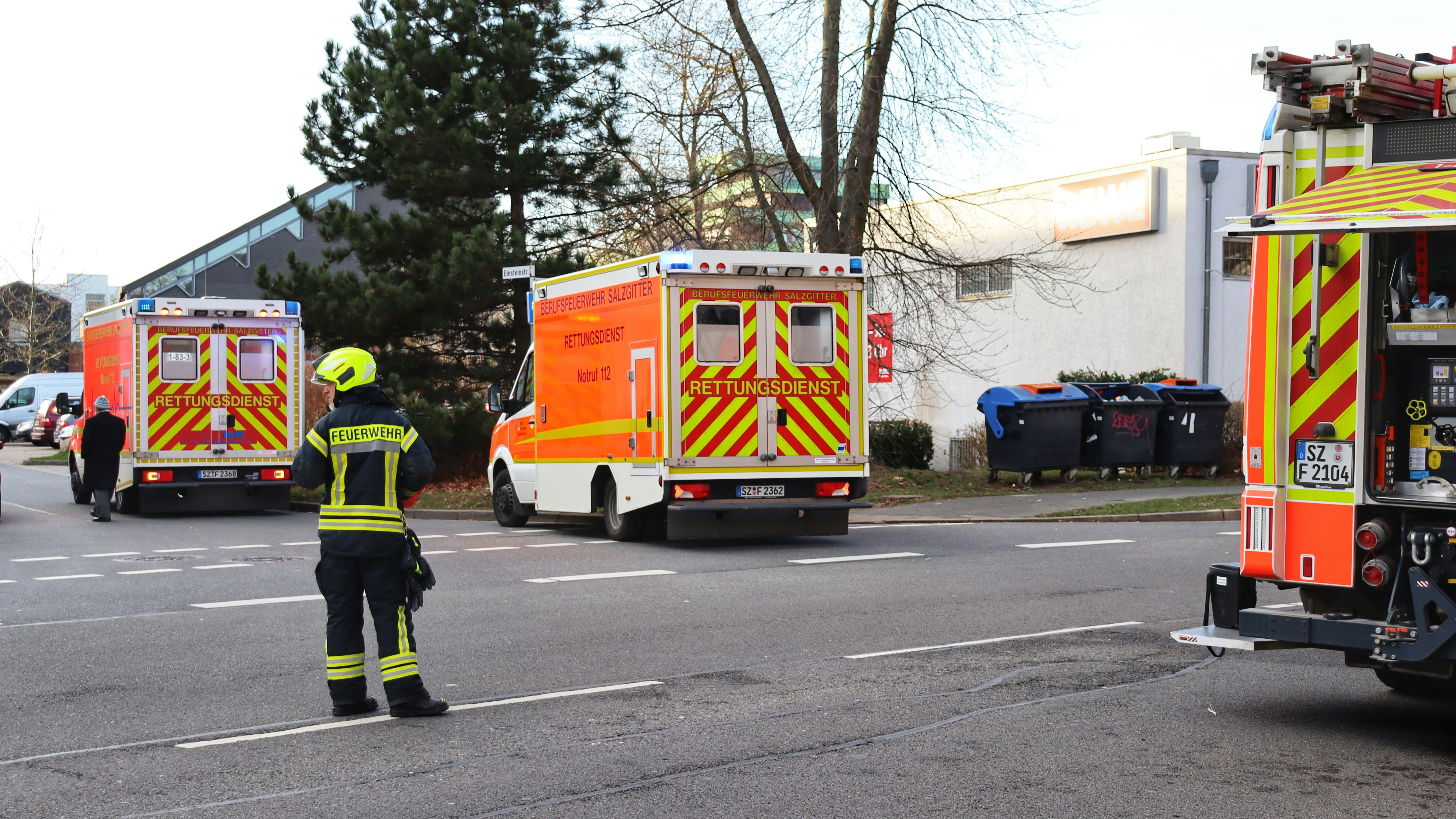 a fireman directing traffic on a city street