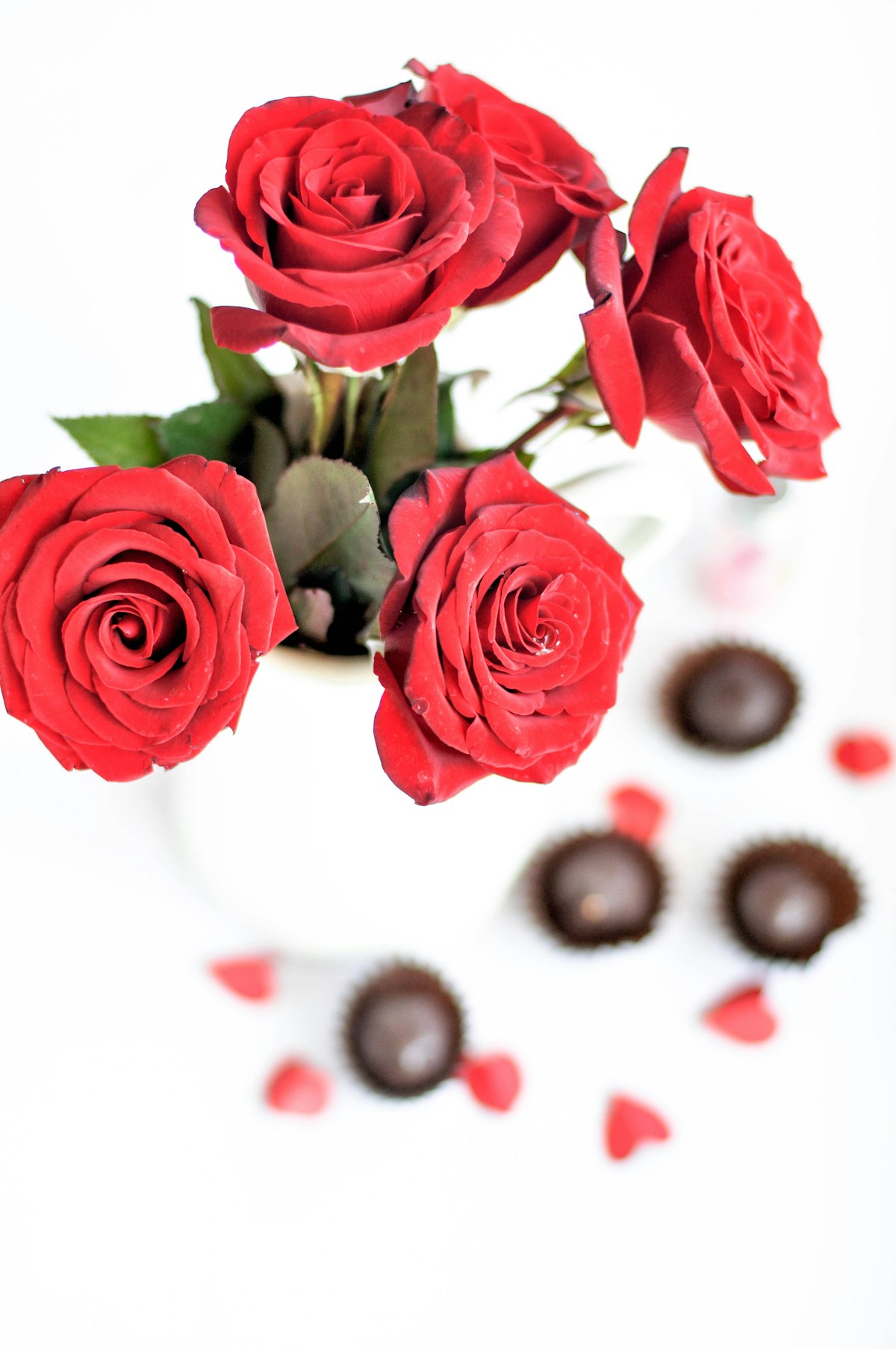 Red roses arranged with heart-shaped chocolates for Valentine's Day representing record consumer spending