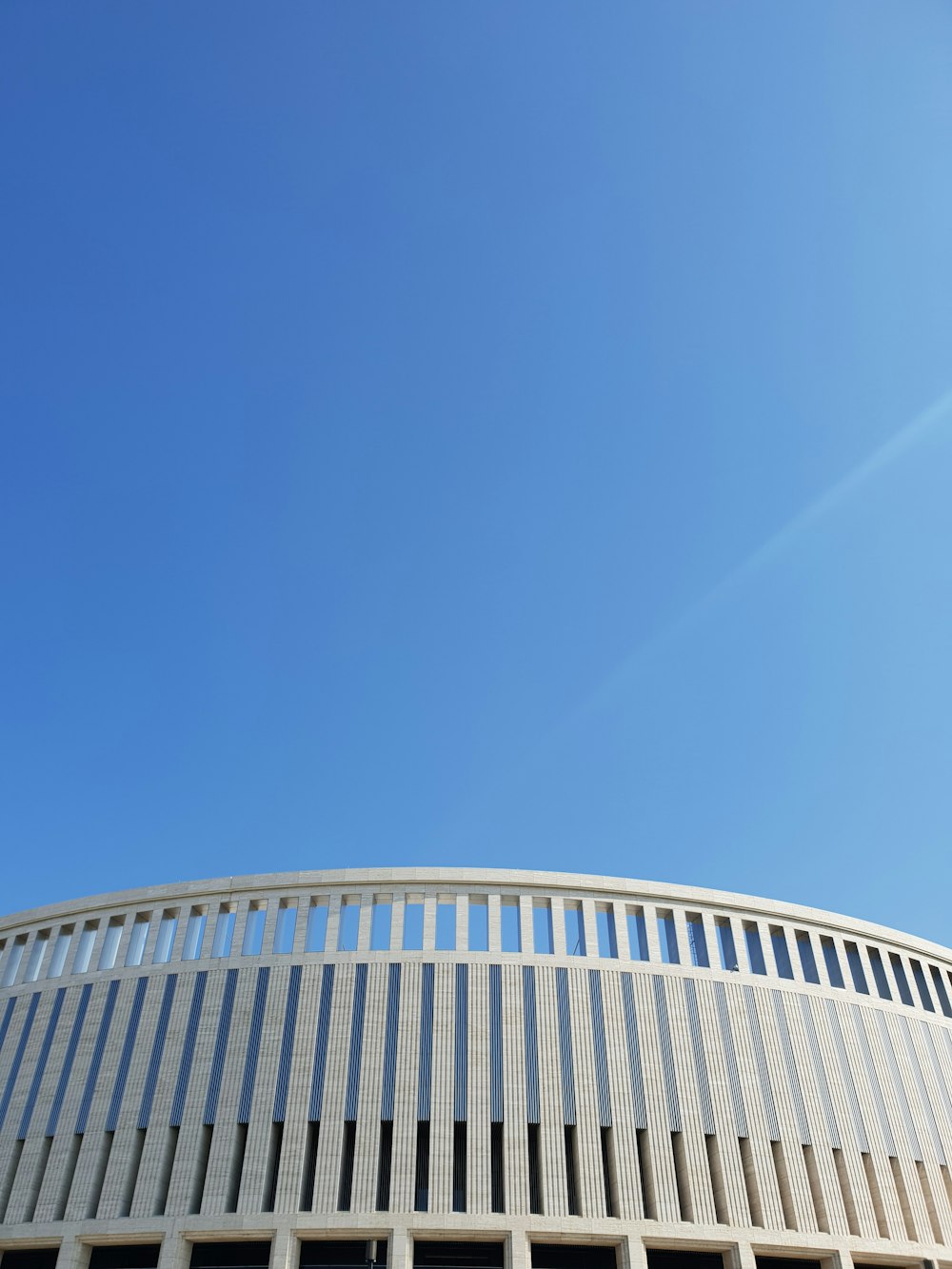 a white building with a blue sky in the background