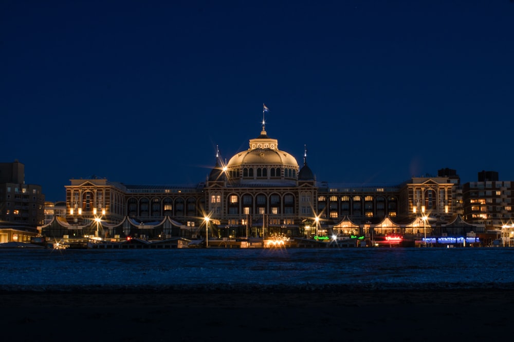 a large building with a dome lit up at night