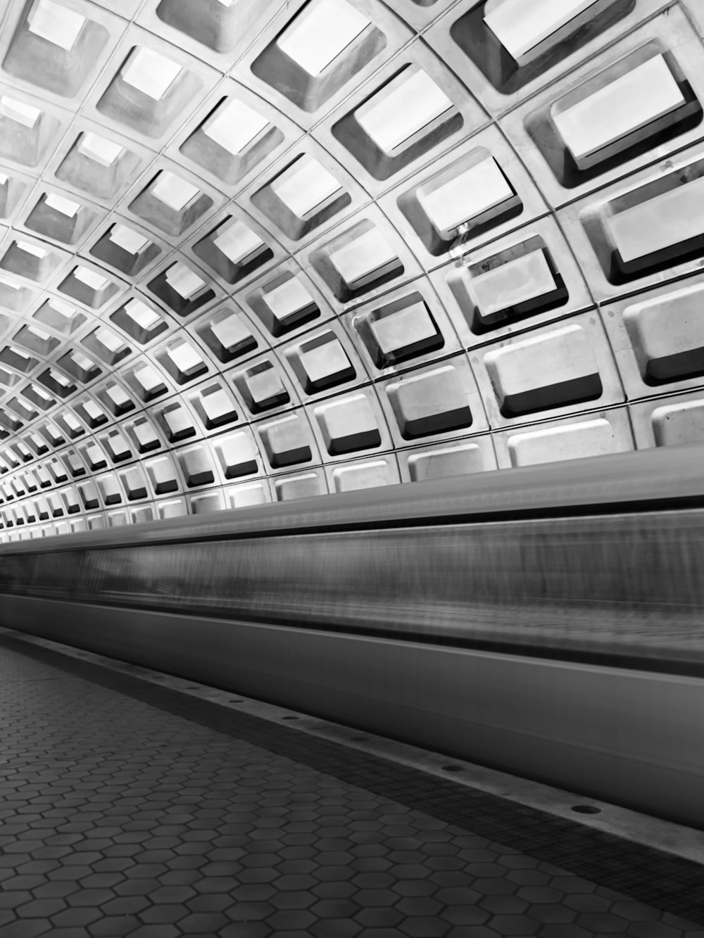 a subway train traveling through a subway station