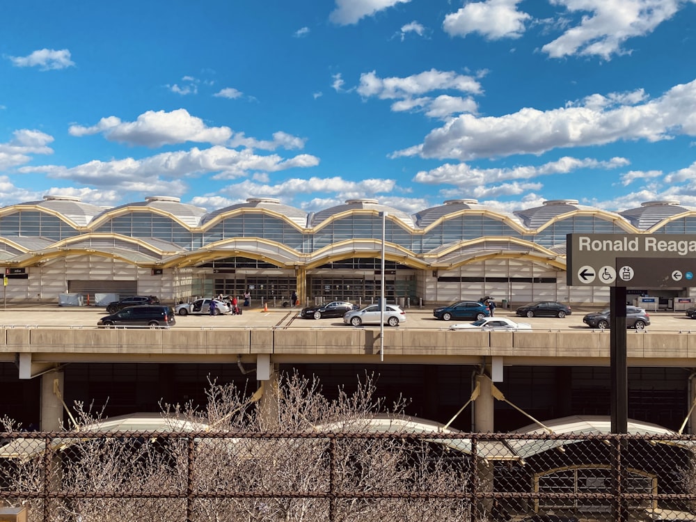 cars are parked in front of a terminal