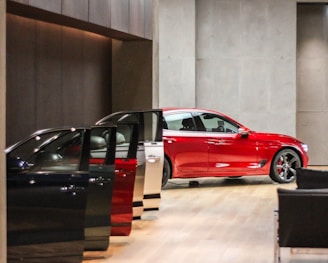 a red car is parked in a building