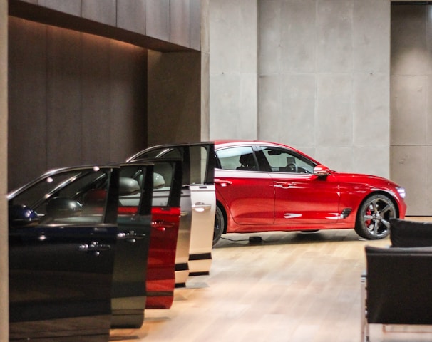 a red car is parked in a building