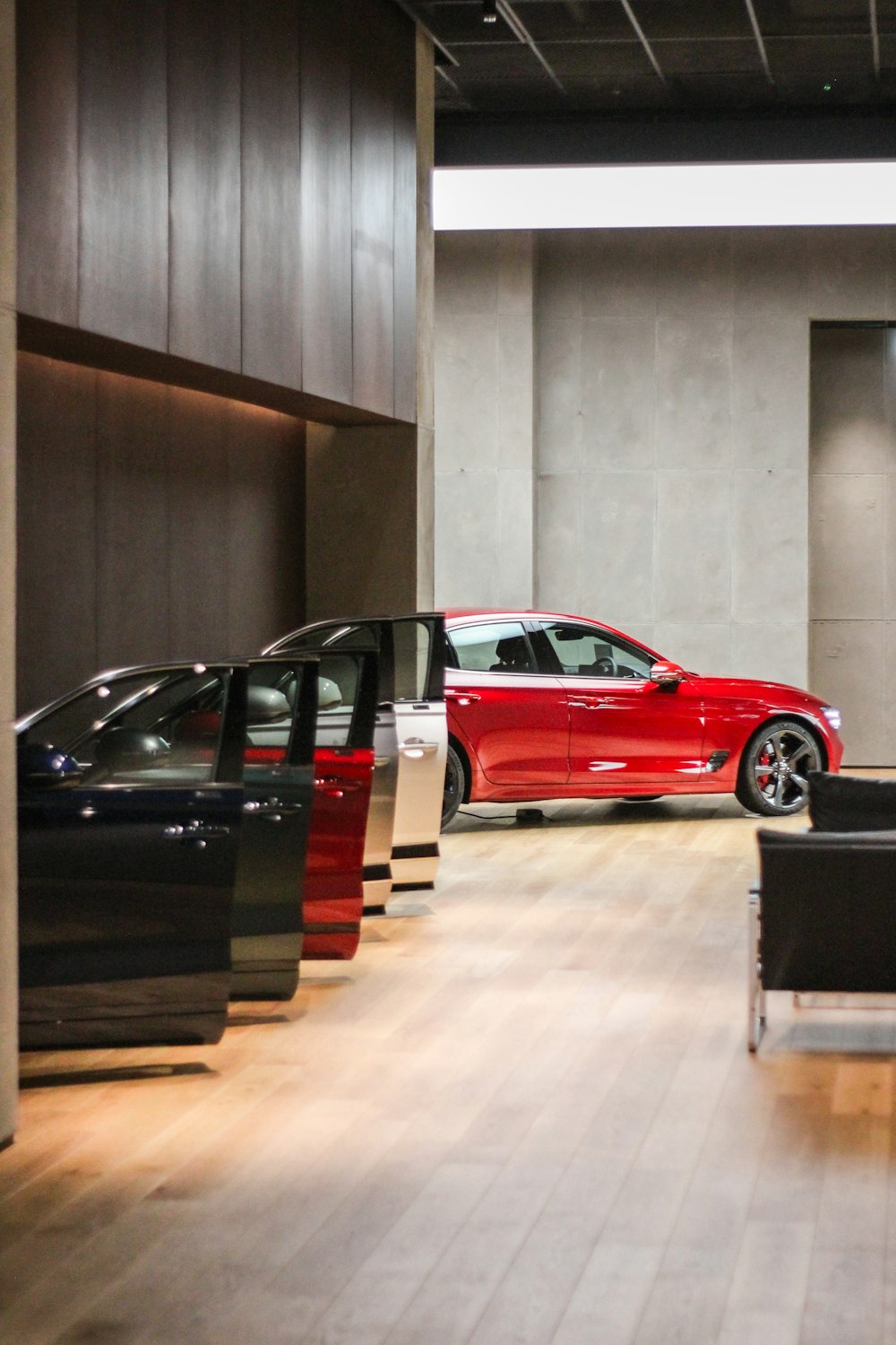 a red car is parked in a building