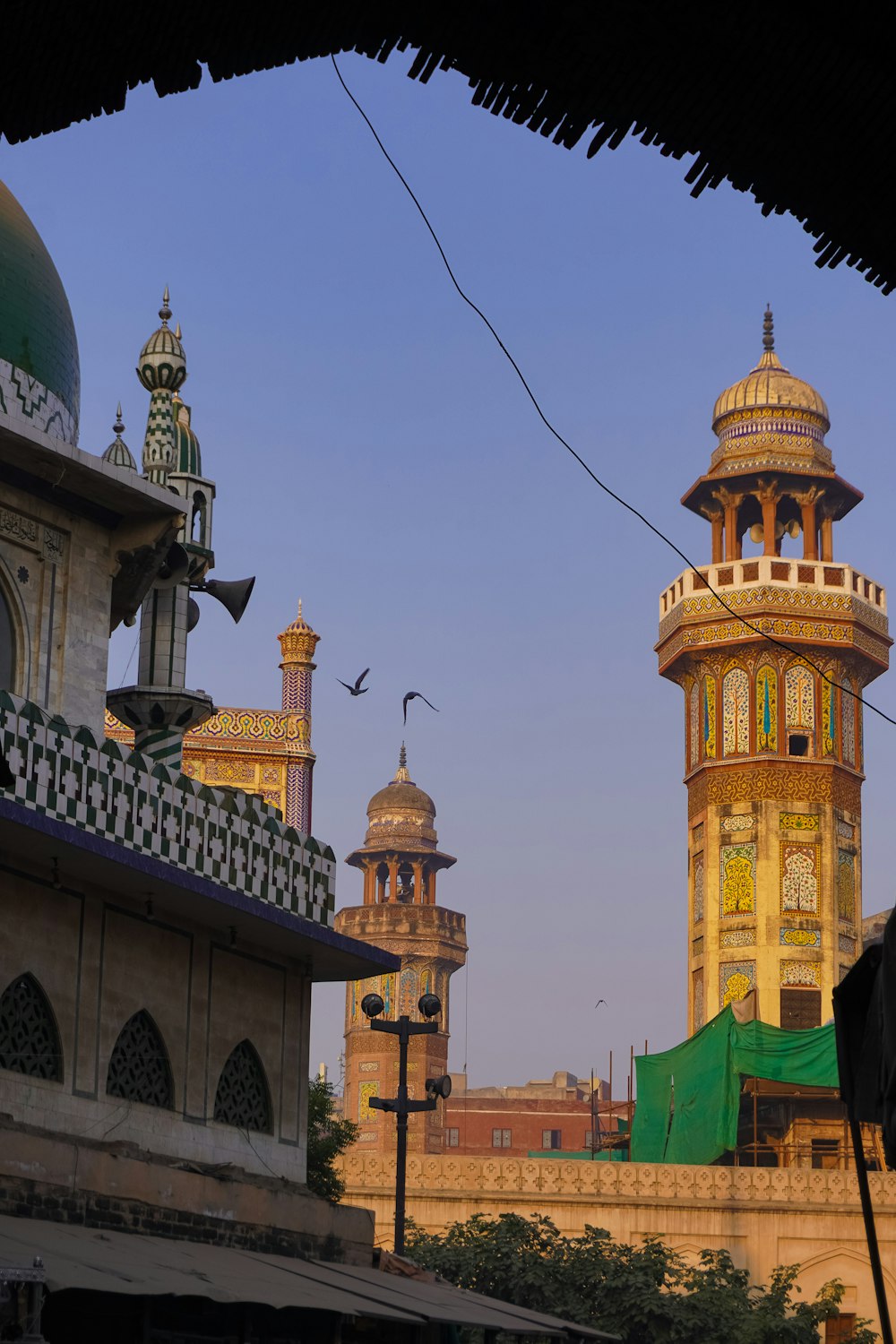 a tall tower with a clock on the top of it