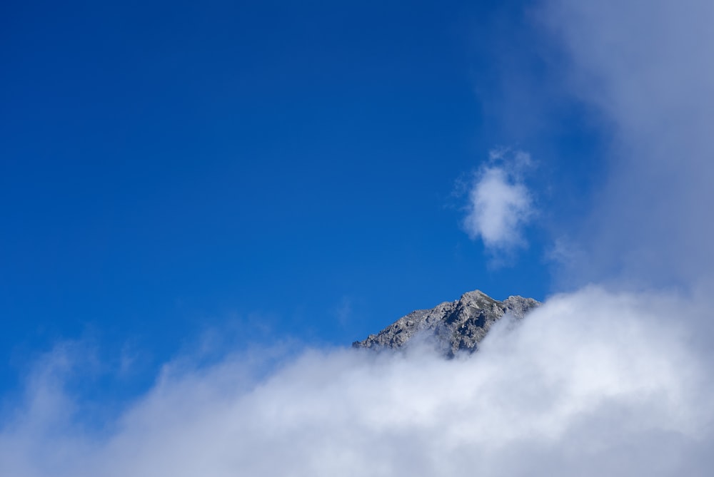 a view of a mountain in the clouds