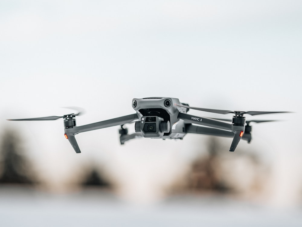 a close up of a camera attached to a small aircraft