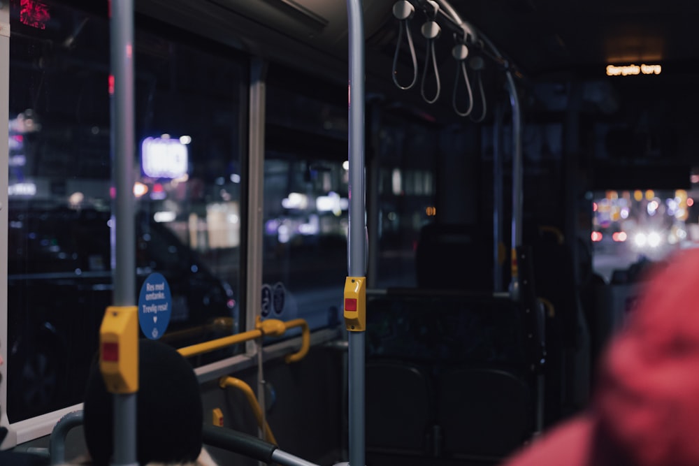a view of a bus at night from inside the bus