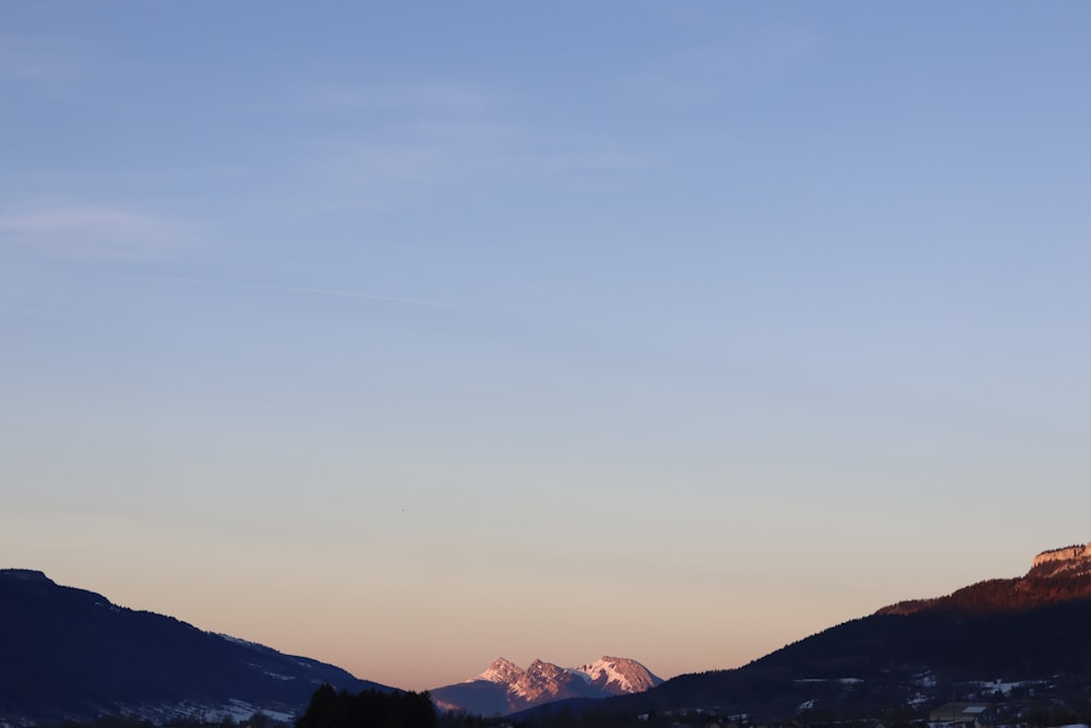 a view of a mountain range at sunset