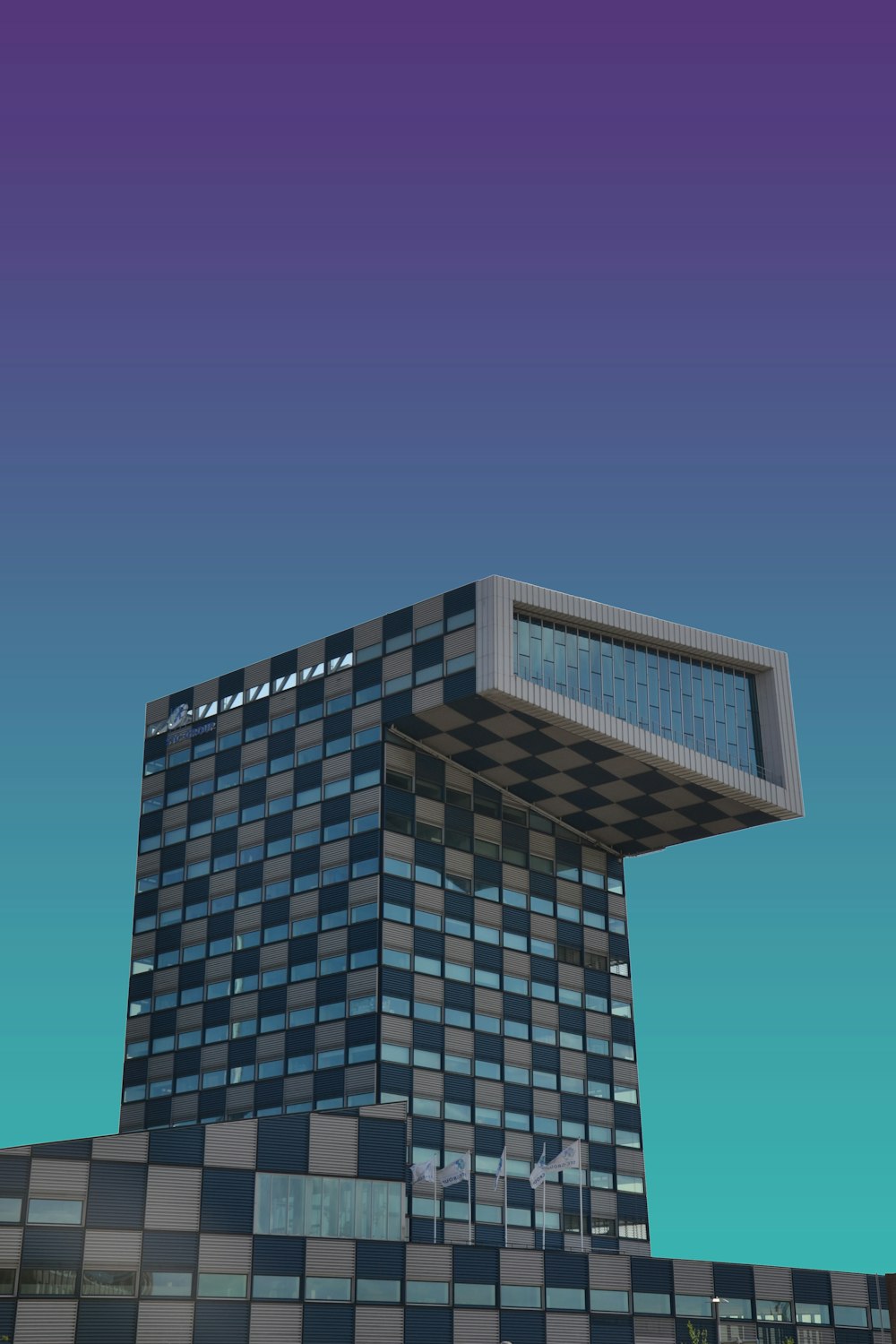 a very tall building with a sky background