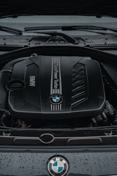 the engine of a bmw car with its hood open