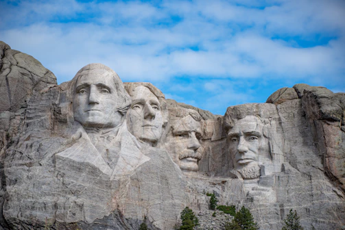a group of presidents carved into the side of a mountain