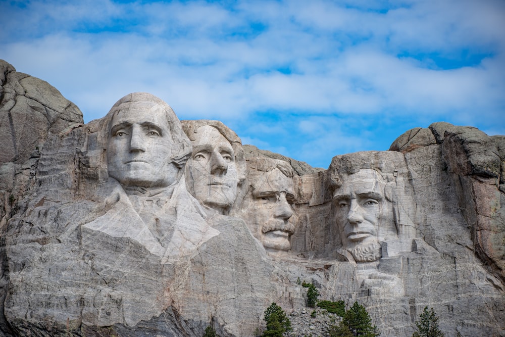 a group of presidents carved into the side of a mountain