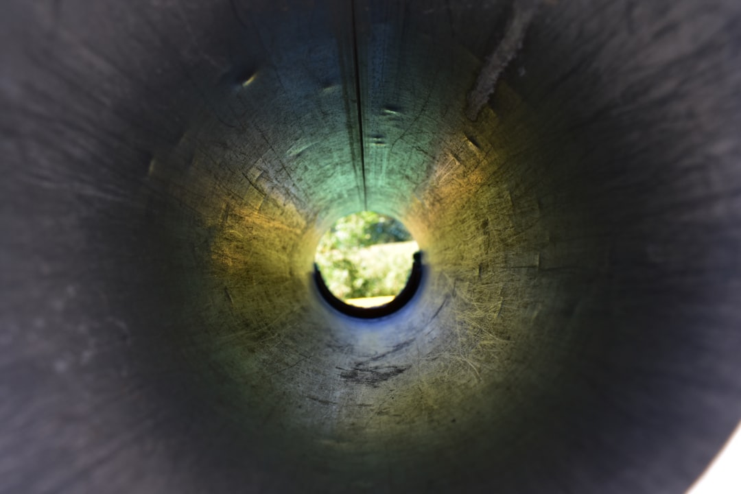 a close up of a metal object with a light at the end,