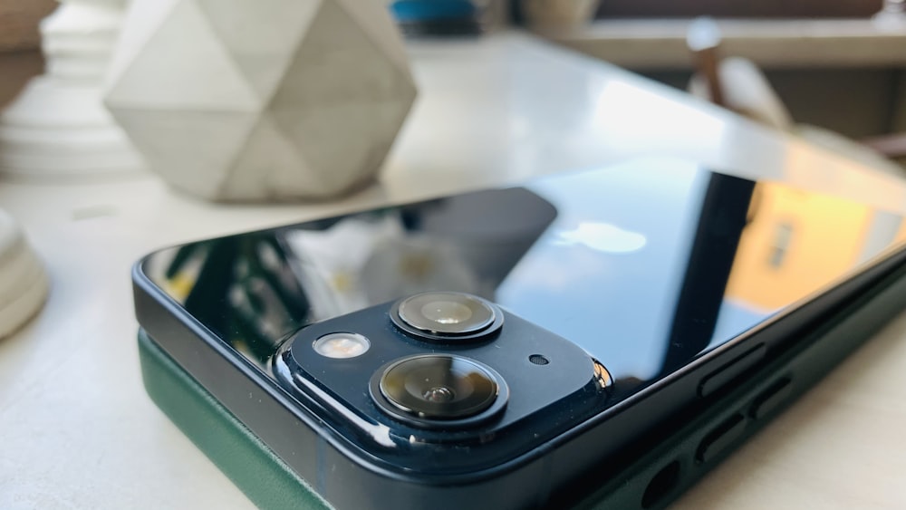 a close up of a cell phone on a table