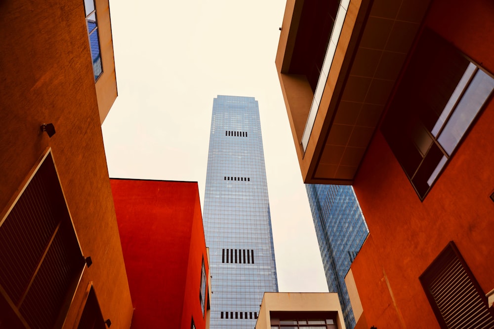 a tall building towering over a city filled with tall buildings