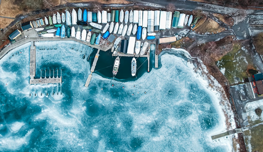 an aerial view of a marina with boats in the water