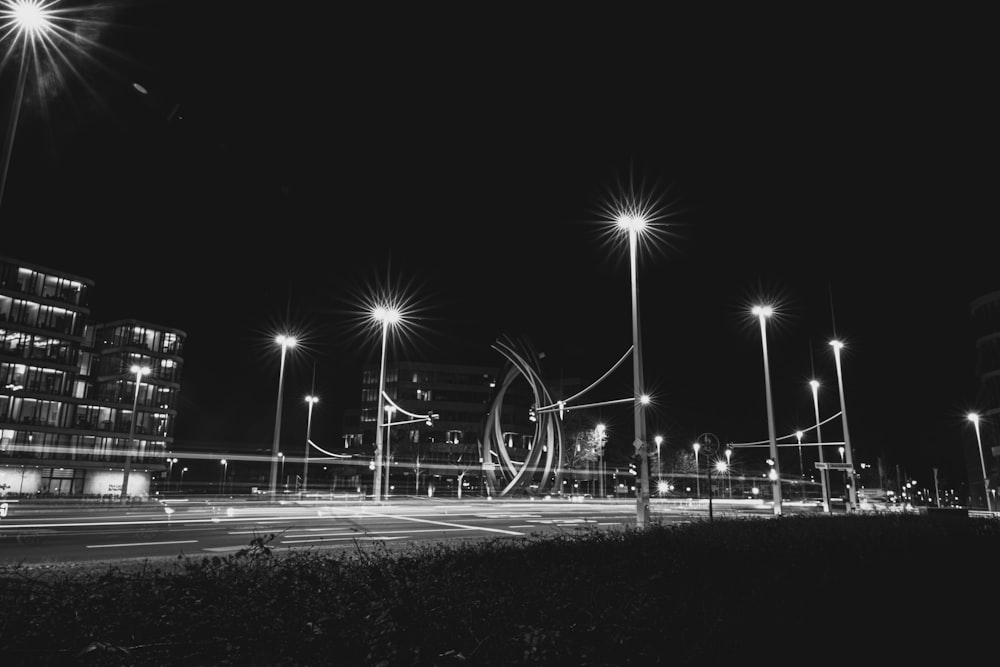 a black and white photo of a city at night