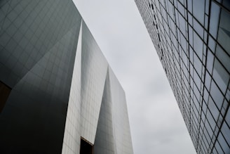 a couple of tall buildings next to each other