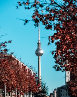 a view of a tall tower with a sky scraper in the background