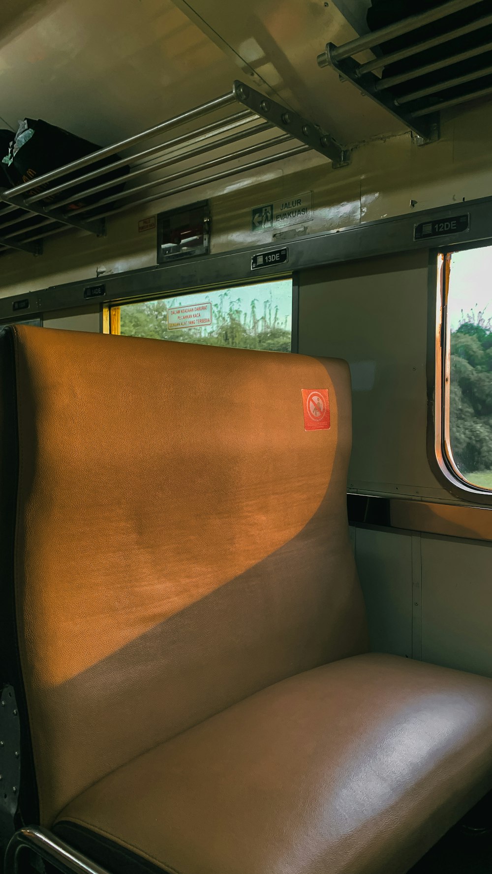 a seat on a train next to a window