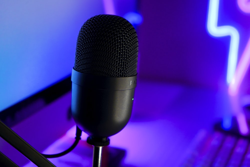 a microphone sitting in front of a laptop computer