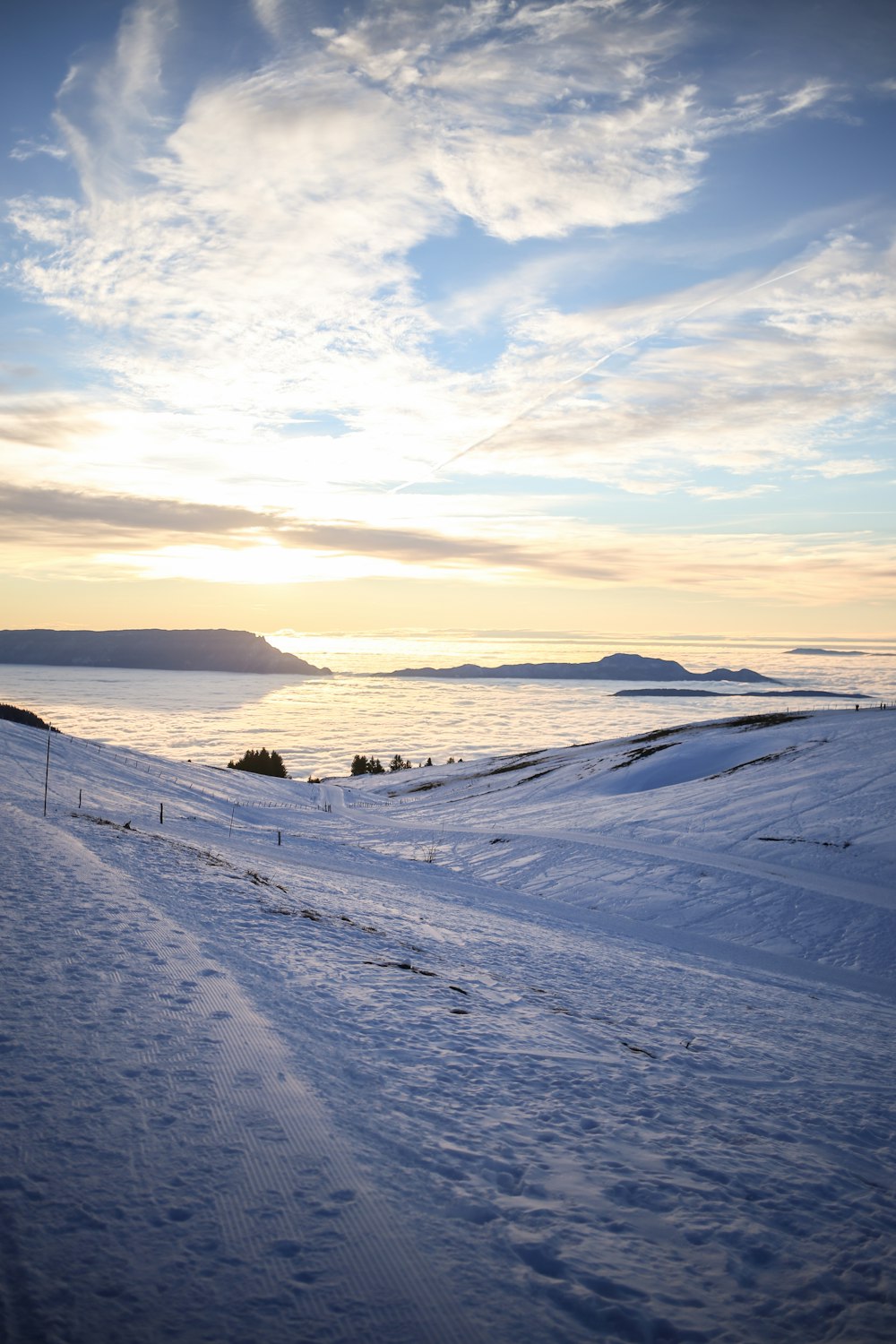 a person riding skis down a snow covered slope