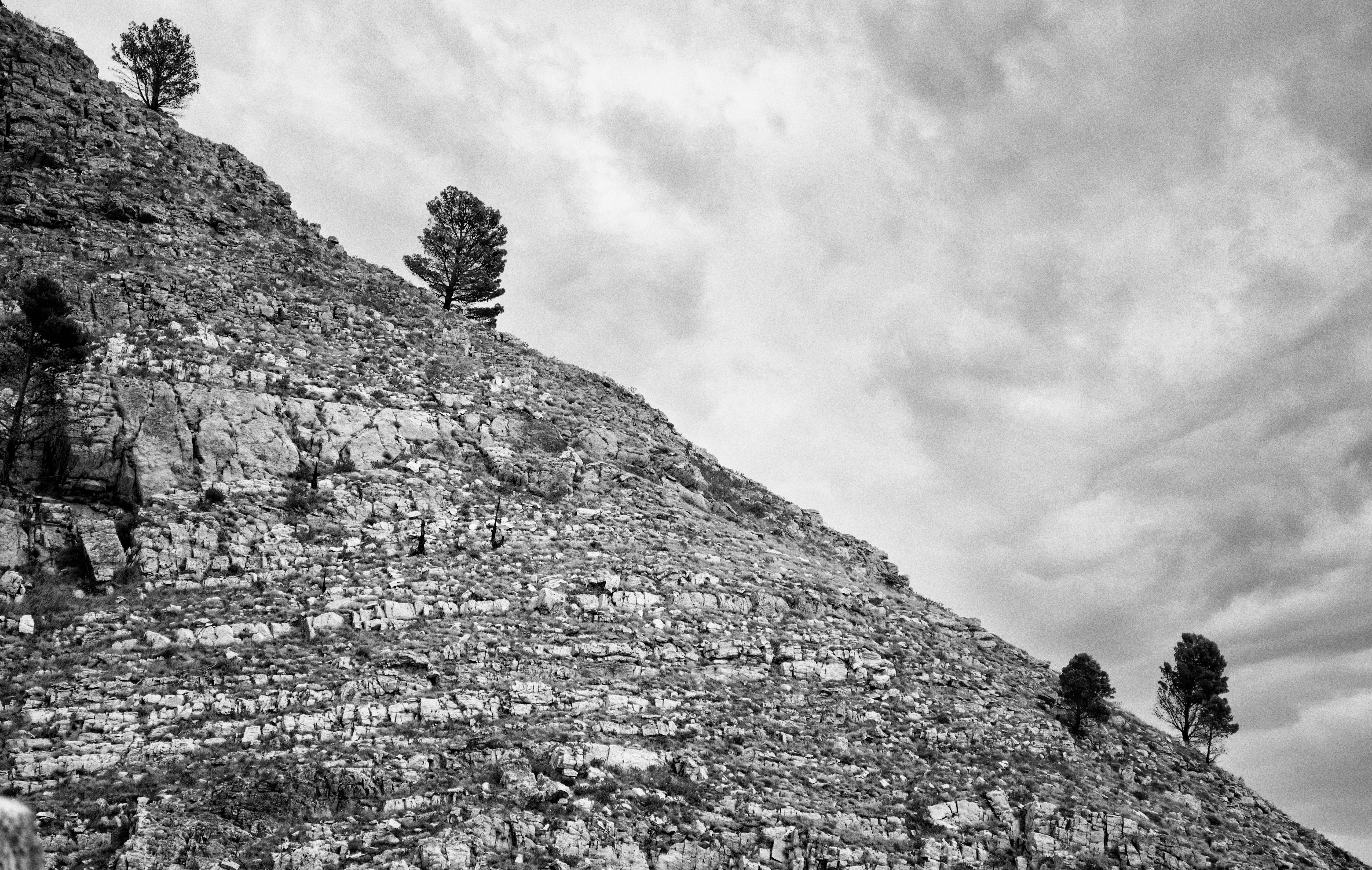 a black and white photo of a stone wall