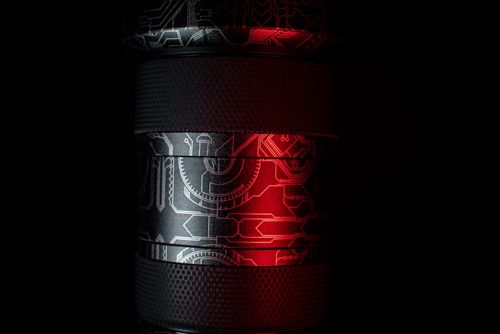 a close up of a red light on a black background