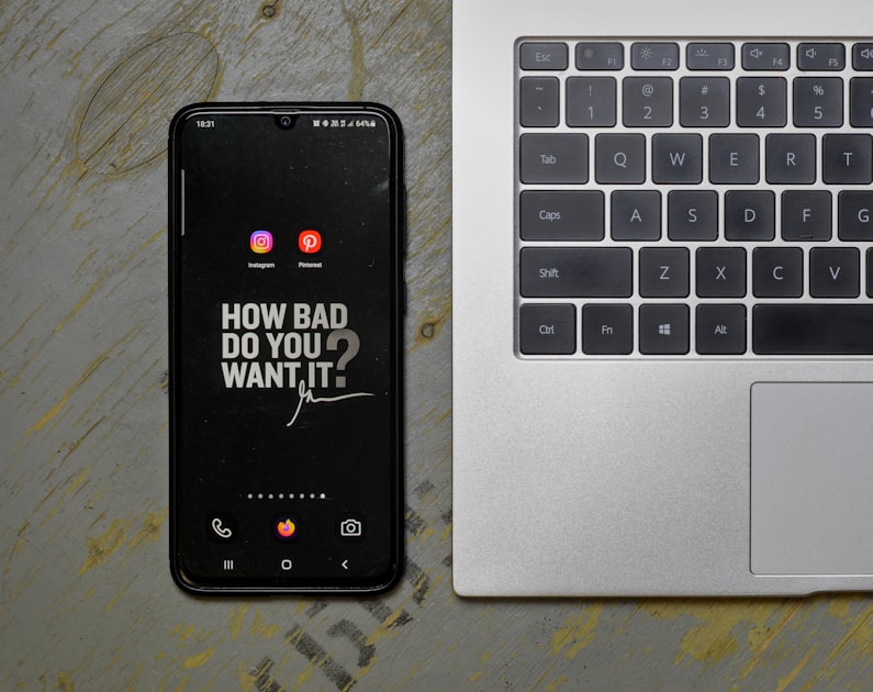 Smartphone displaying Instagram app and social media icons on screen