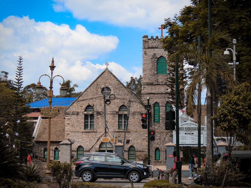 a car is parked in front of a church