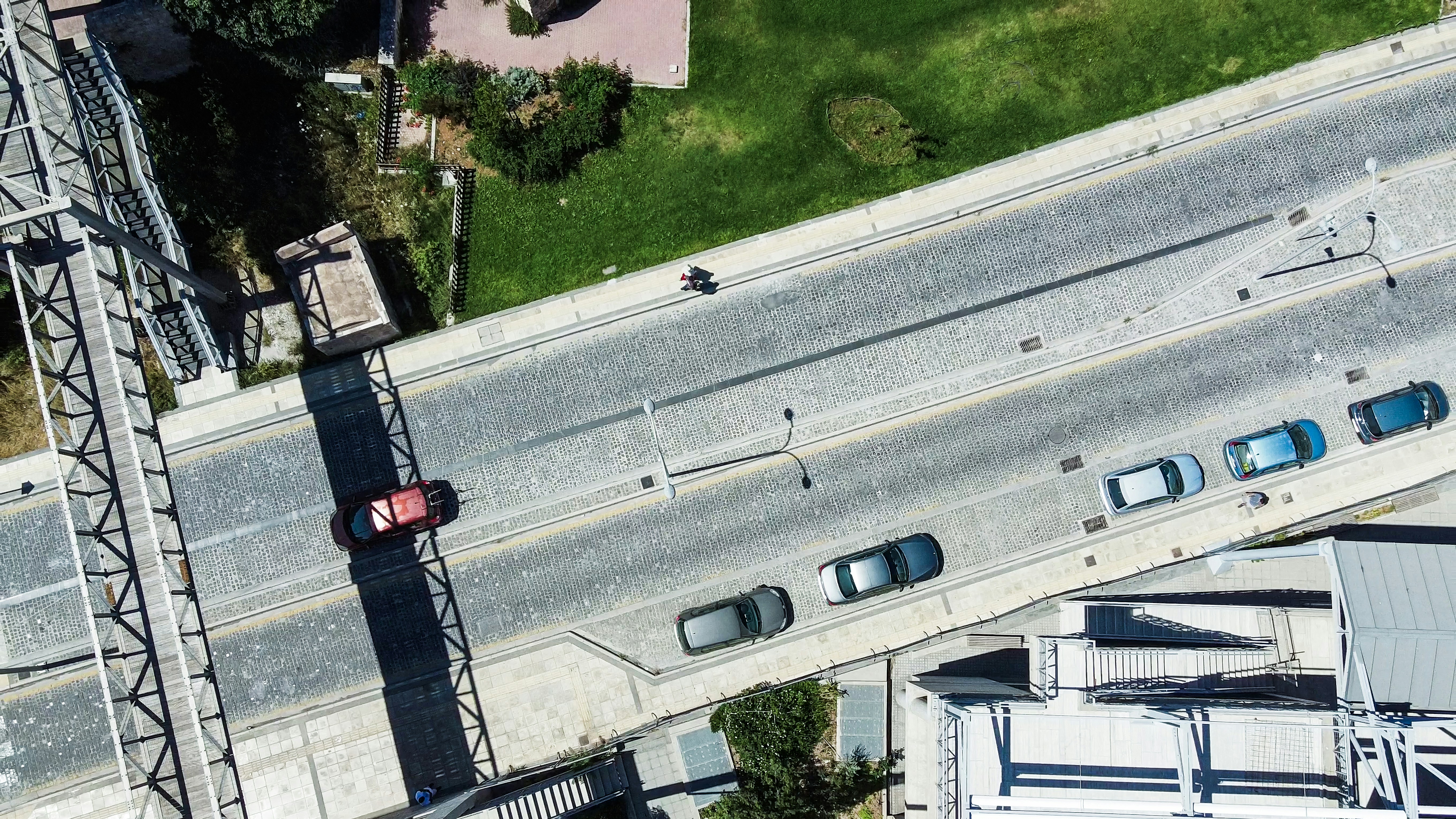 an aerial view of a street and a bridge