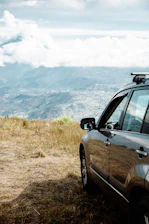 a car parked on the side of a hill