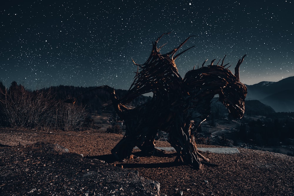 a sculpture of a horse on top of a hill