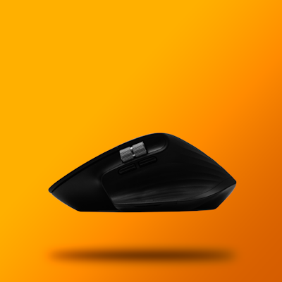 a black computer mouse flying through the air