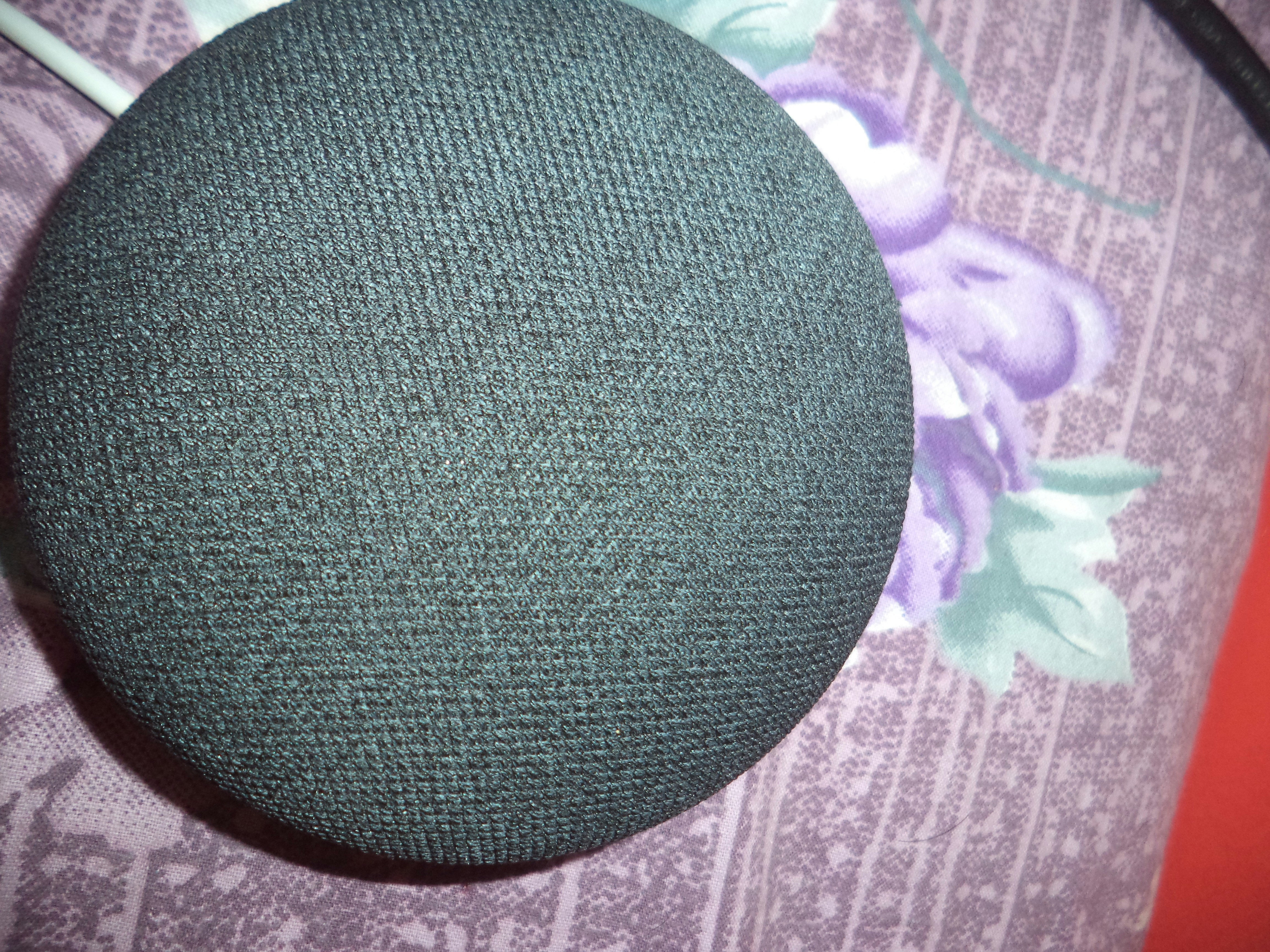 a close up of a speaker on a bed