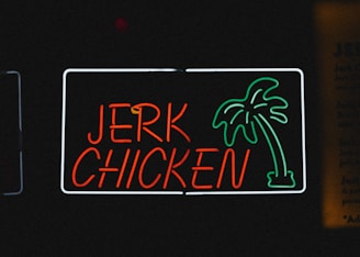 a neon sign with a palm tree on it