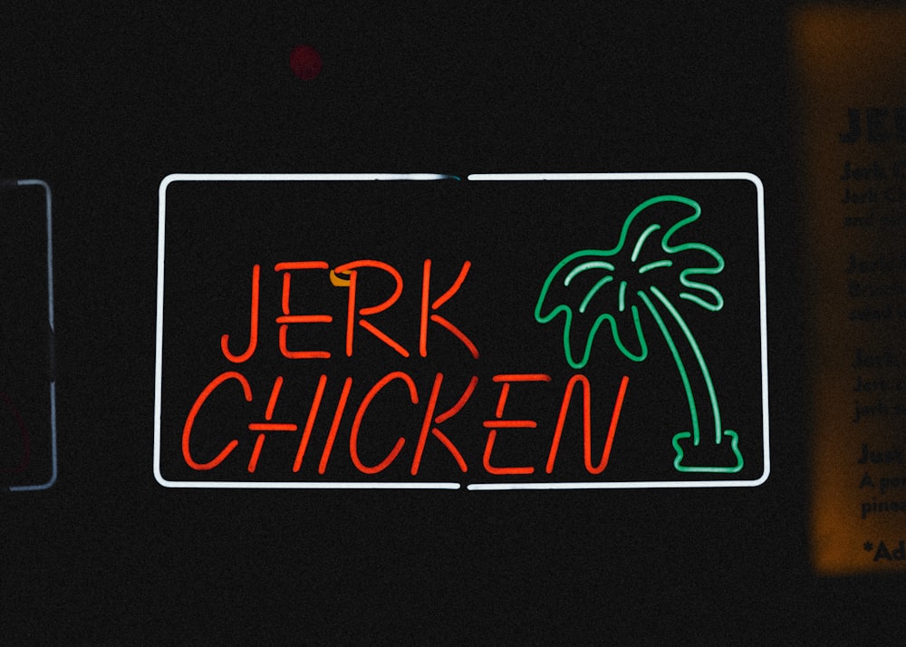 a neon sign with a palm tree on it